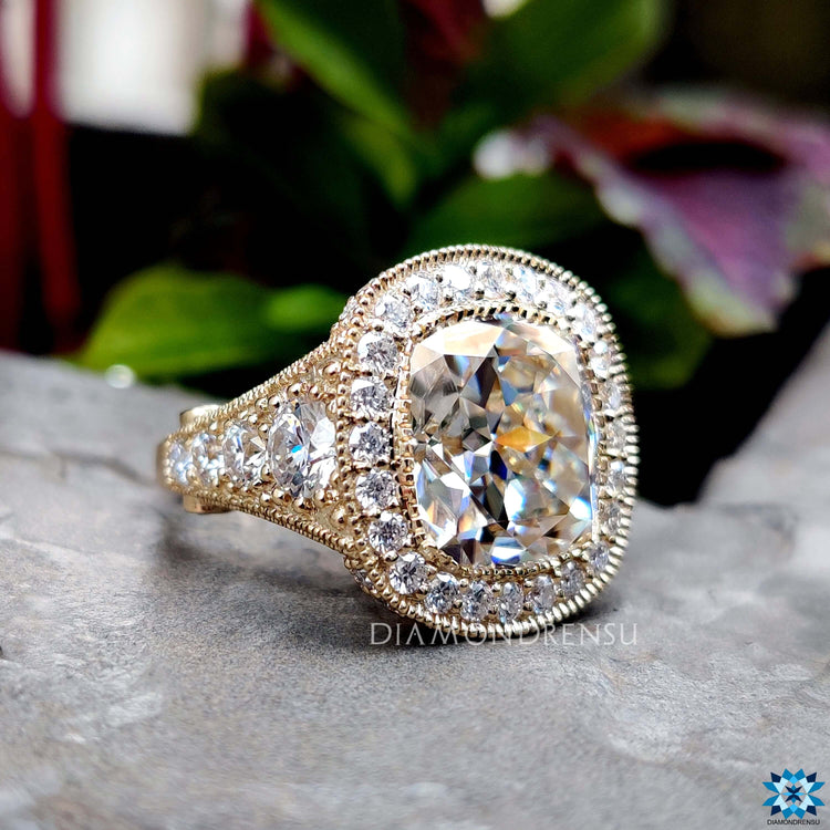 Handmade cushion moissanite ring in prong setting.
