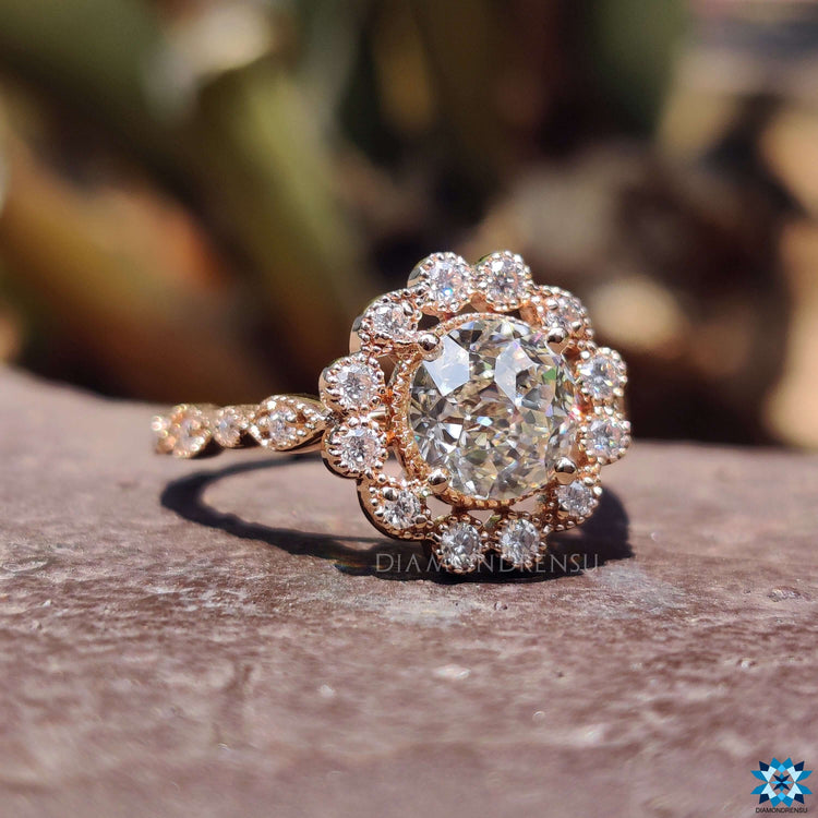 Rose gold ring featuring Jubilee cut moissanite.
