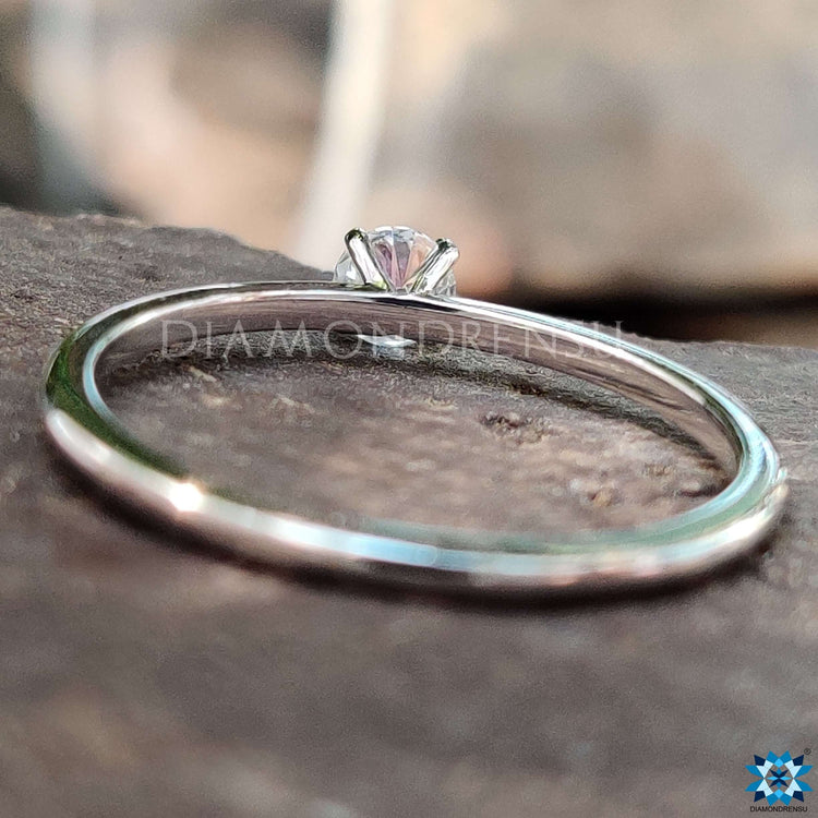 White gold round solitaire engagement ring.
