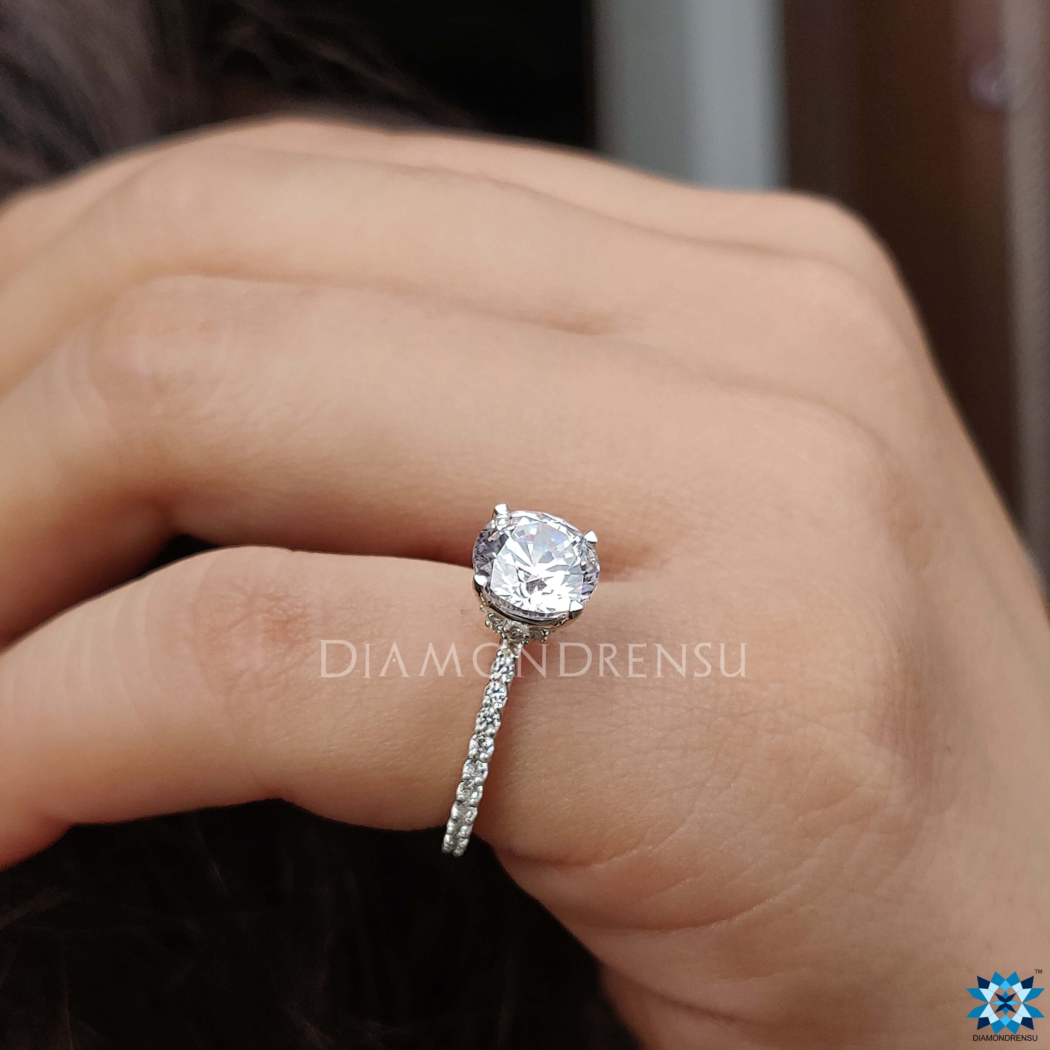 Moissanite ring UK with a beautiful round cut and hidden halo for extra shine.