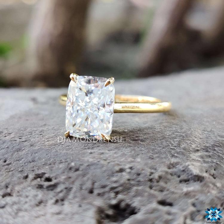 Cathedral setting ring showcasing an elongated cushion moissanite.
