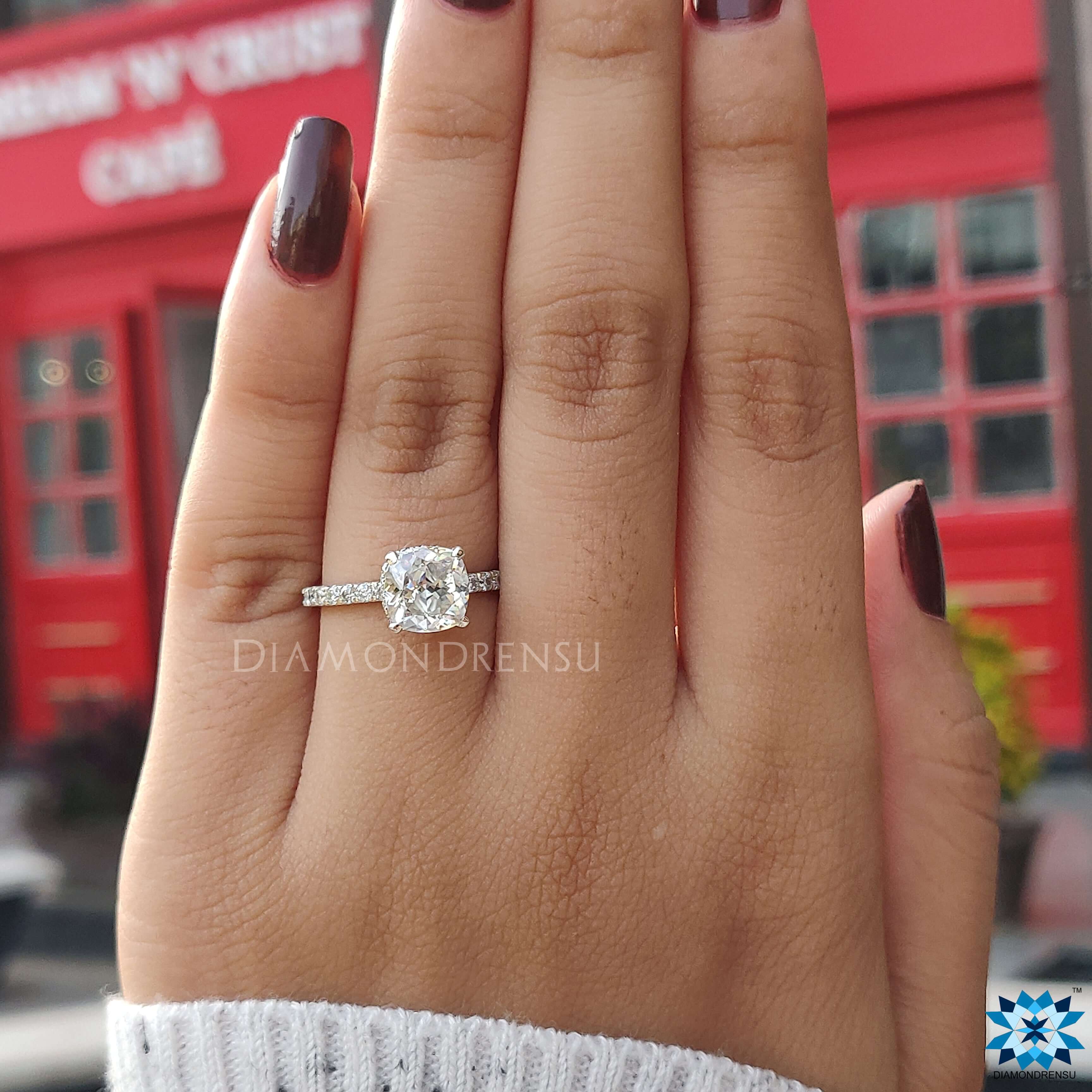 Moissanite for engagement ring with a gorgeous cushion cut stone in a white gold band.