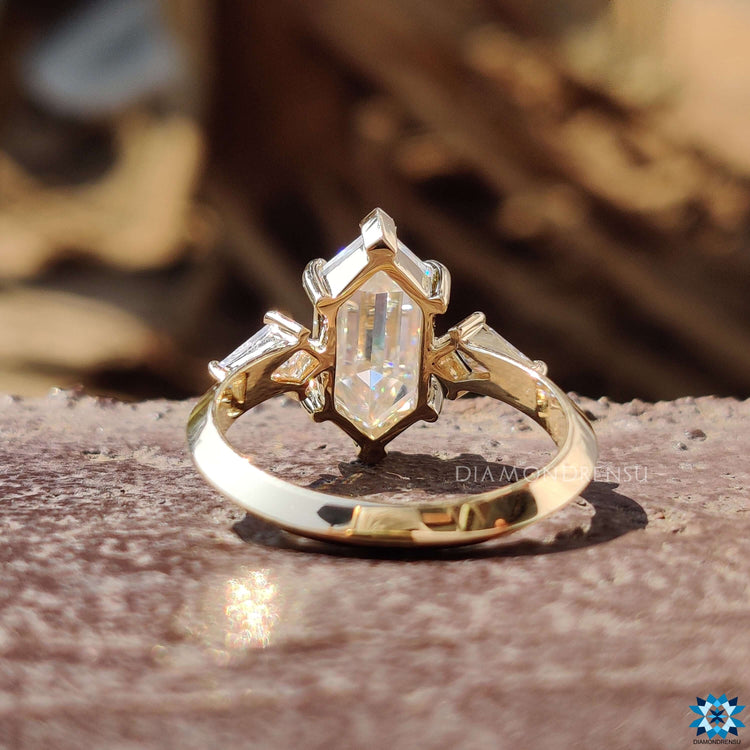 Yellow gold ring with prong setting design.
