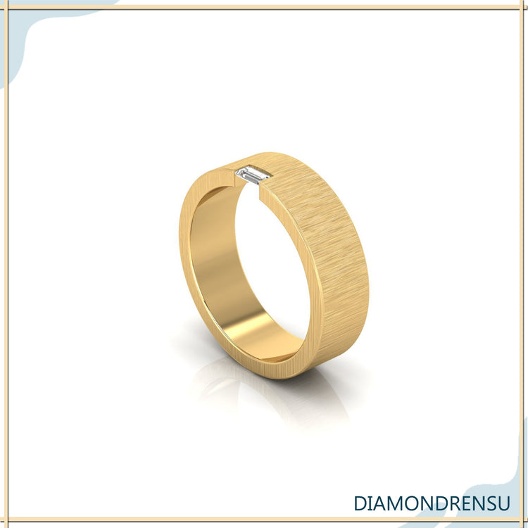 Diamondrensu UK wedding band with brush finish and single baguette diamond.
