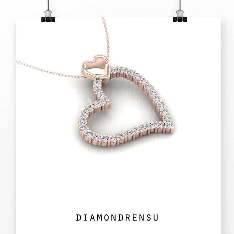 Double heart pendant in white gold with elegant design.
