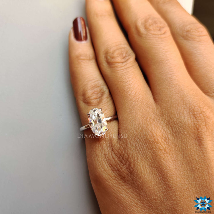 Custom solitaire engagement ring with Moval cut center.
