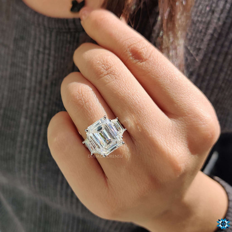Cathedral setting moissanite ring in white gold.
