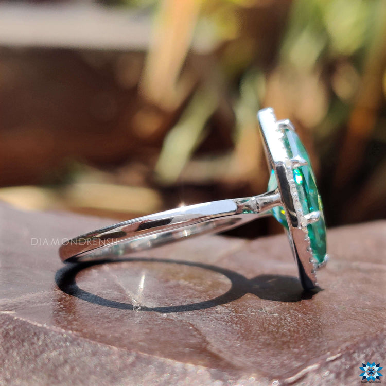 Cyan blue moissanite engagement ring.