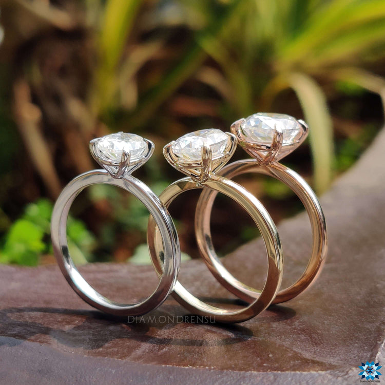 White gold oval moissanite engagement ring.
