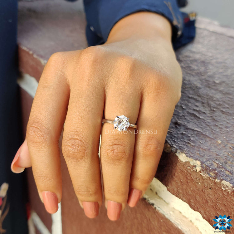 White gold engagement ring with octagon cut center stone.
