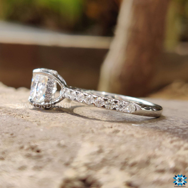 Hidden halo engagement ring with cushion moissanite.
