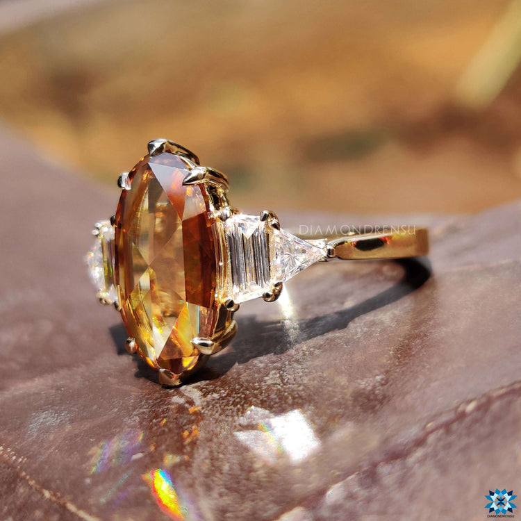 Engagement ring with trapezoid and triangle side stones.
