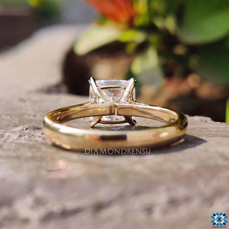Custom engagement ring featuring Cushion Rensu stone.
