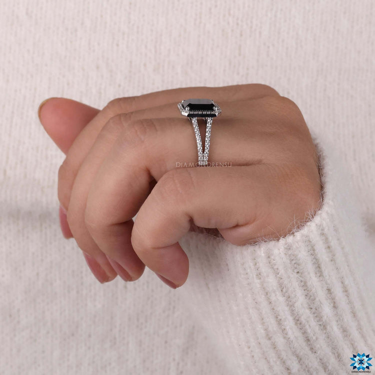 Proposal ring with black emerald cut moissanite and round side accents.
