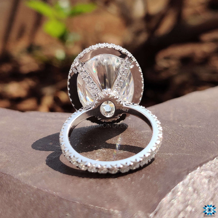 Custom engagement ring with side and hidden halo.
