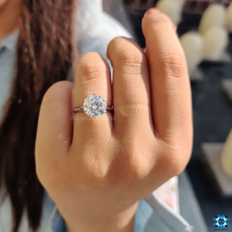 Solitaire moissanite ring with 6 claw prong setting.
