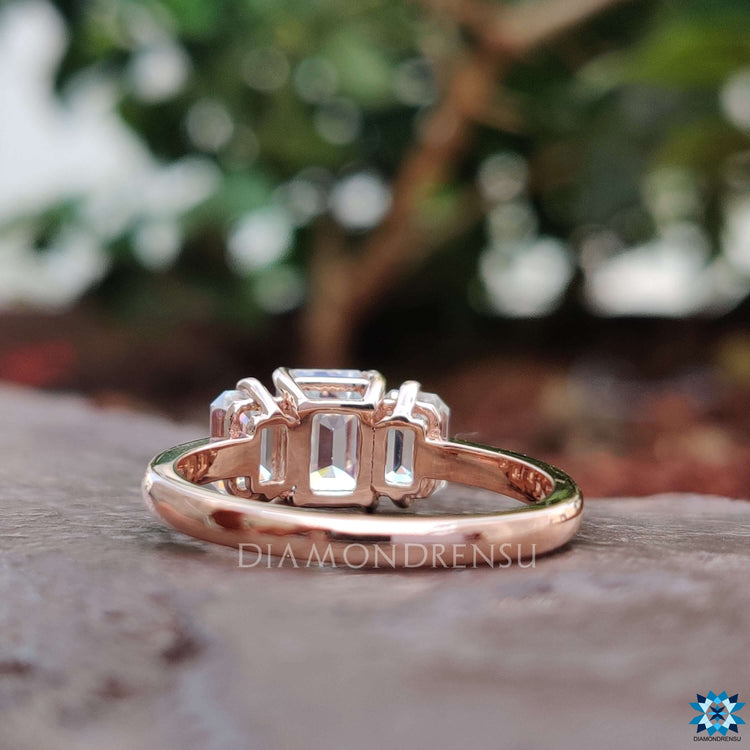 Custom rose gold ring featuring moissanite center.
