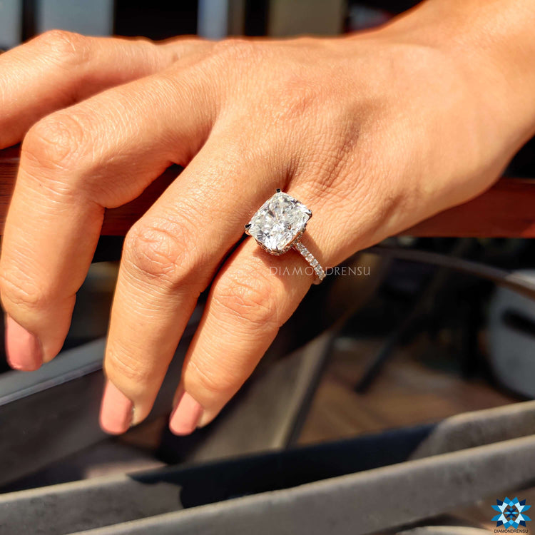 Pave setting moissanite ring in dual tone gold.
