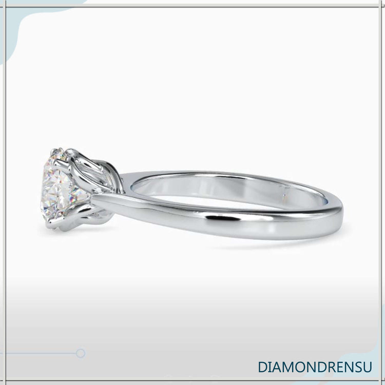 Custom design ring in rose gold with round diamond setting.
