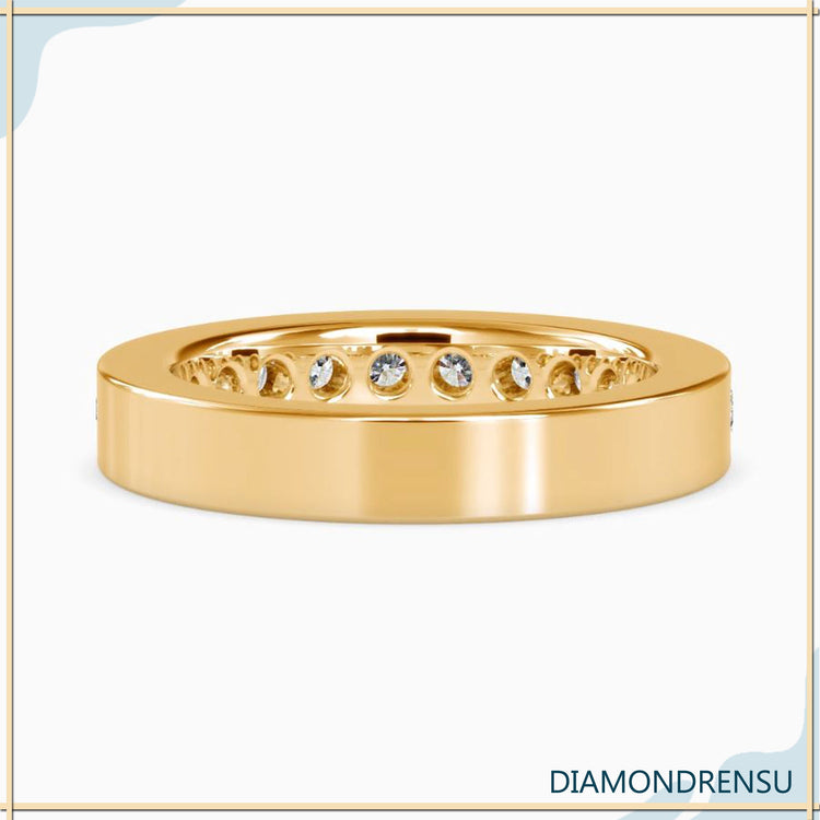 Yellow gold diamond band in half eternity channel setting.

