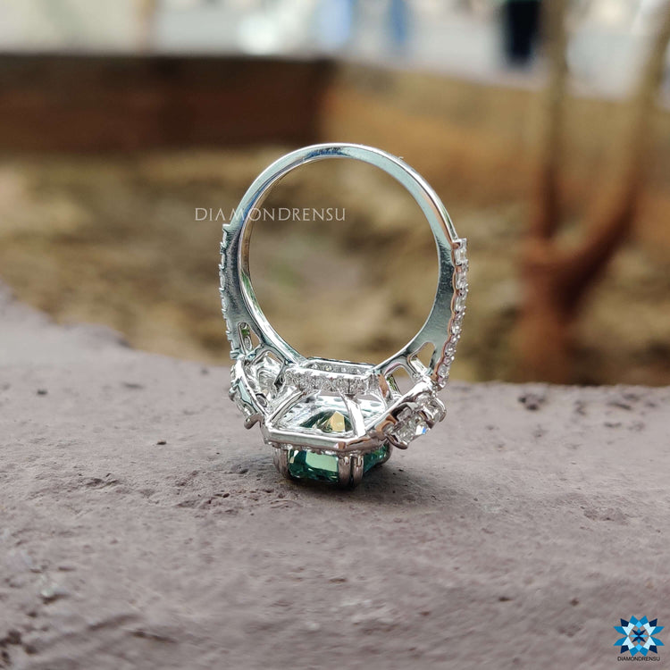 Handmade three stone ring with radiant and half moon cuts.
