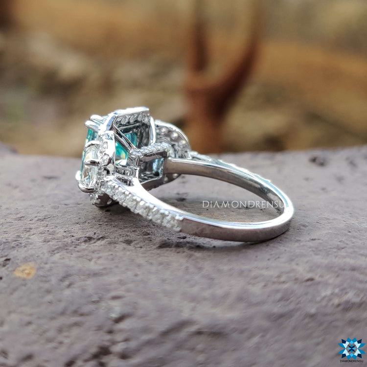 Moissanite engagement ring with double claw prong setting.
