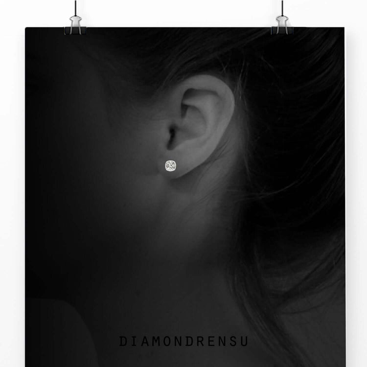 Bezel set earrings with cushion cut lab diamonds.
