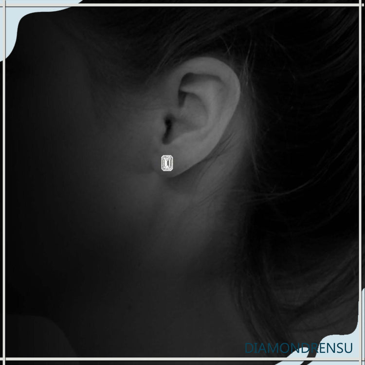 Handmade bezel set emerald step cut diamond earrings.
