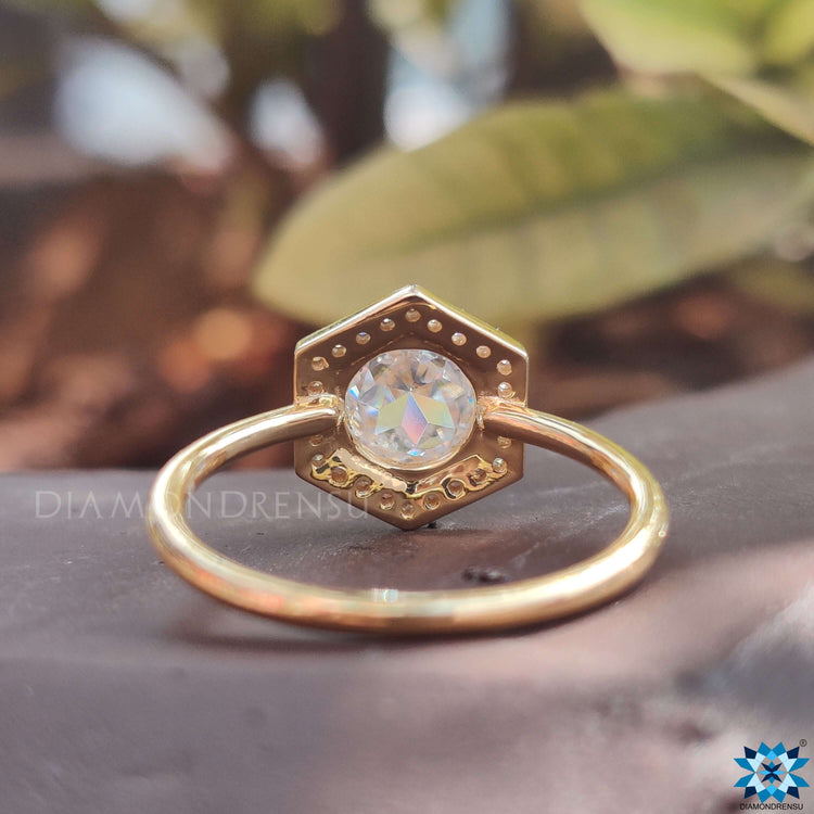 Round cut rose moissanite with halo setting.
