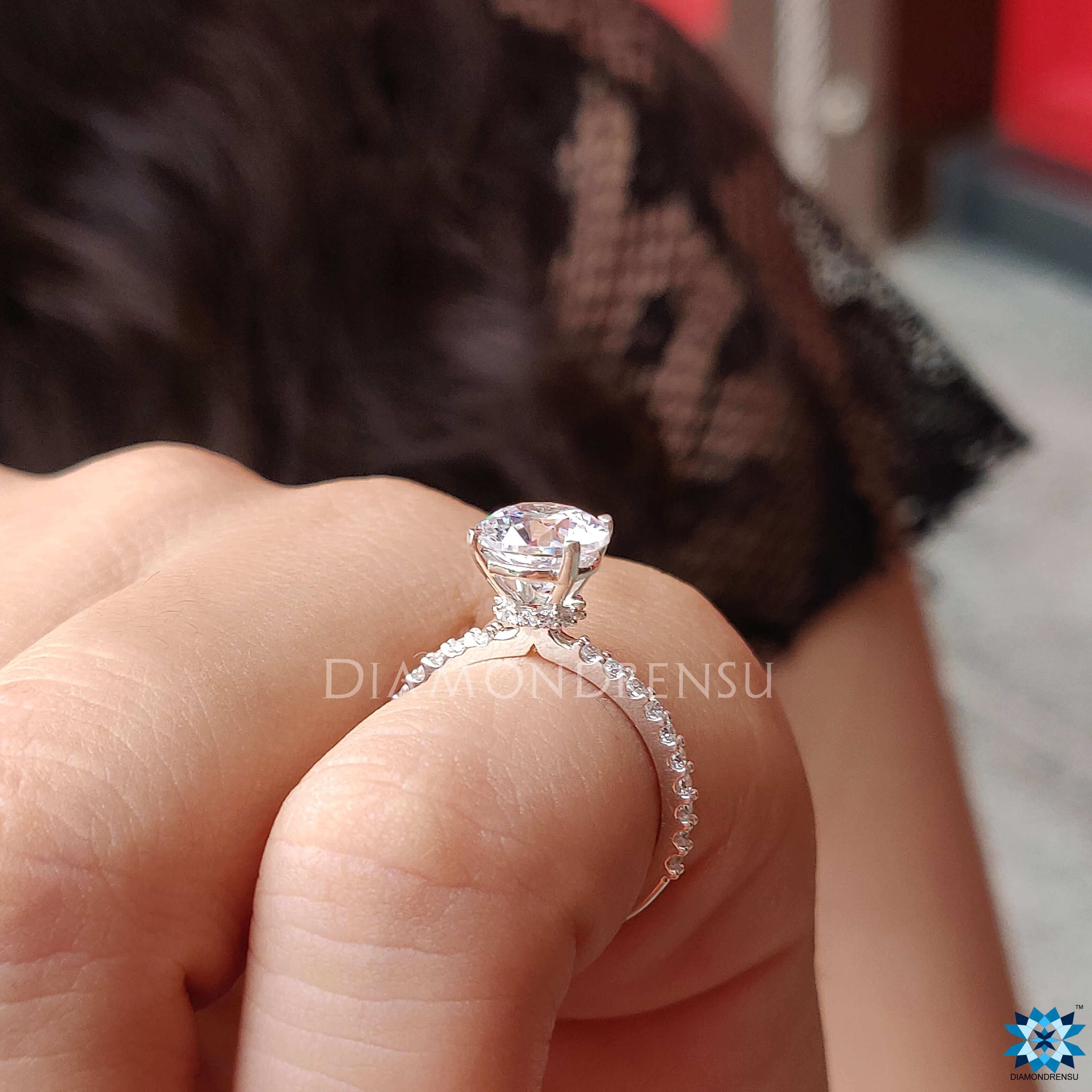 Shop to buy moissanite ring featuring a timeless round cut design and halo setting.