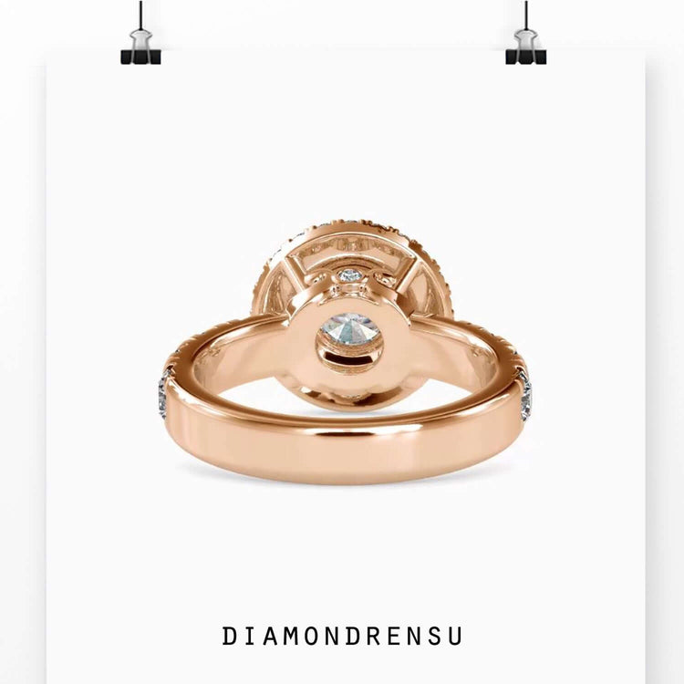 Round diamond ring with custom halo and hidden side accents.
