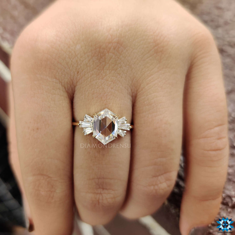 Hexagon center stone ring with baguette side stones.

