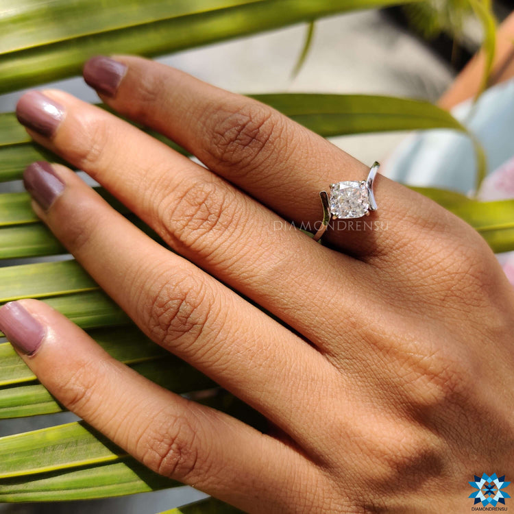 Handmade jewelry featuring cushion cut moissanite center.
