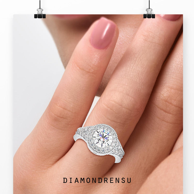 Round cut diamond ring with pavé split shank band.
