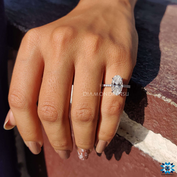 White gold ring with Moval cut center stone.
