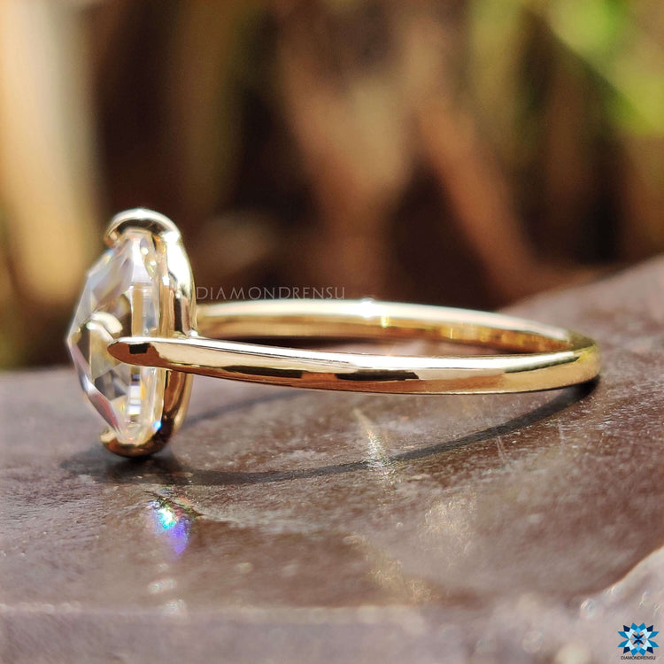 Yellow gold engagement ring with cushion center.
