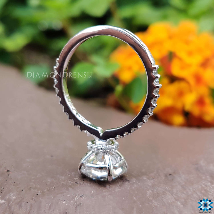 Handmade octagon moissanite ring with 4 claw prong setting.
