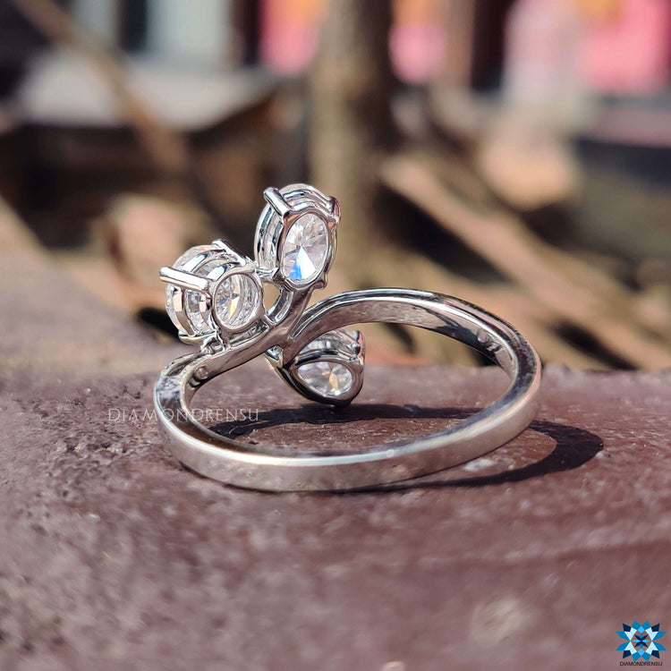 Custom engagement ring with three stone layout.
