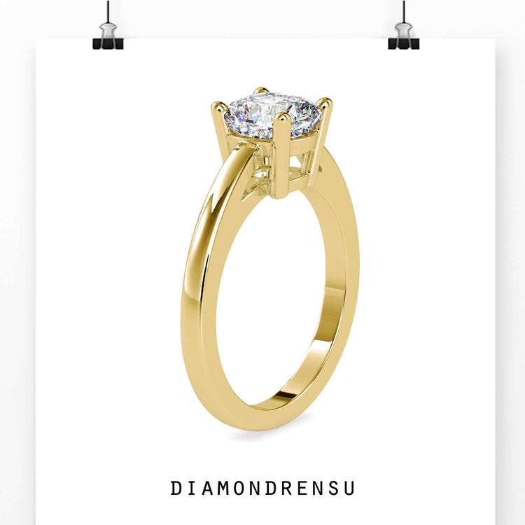 Custom engagement ring designed with a rose gold ring and cushion cut centre diamond.
