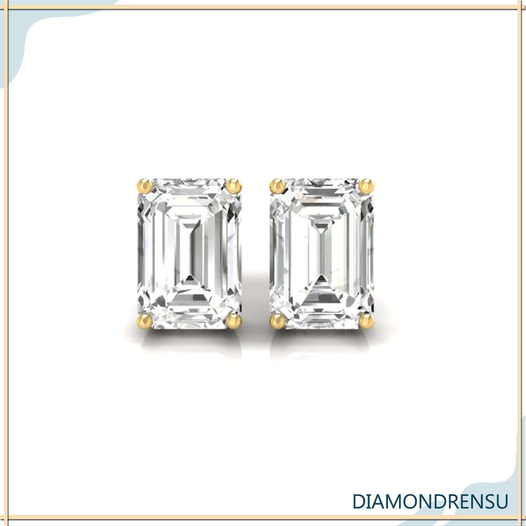 Prong setting earrings holding emerald cut diamonds.
