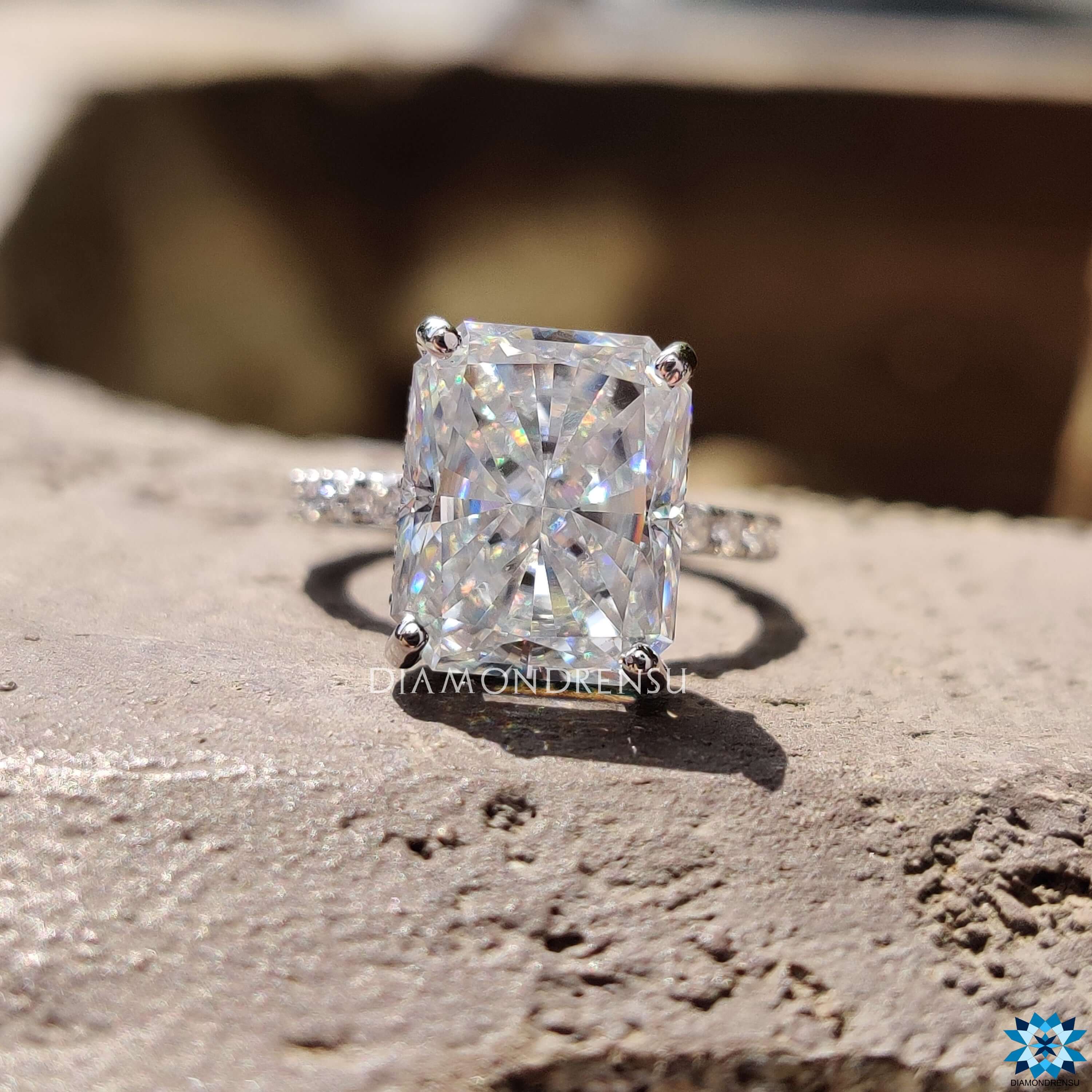 Moissanite pave ring with a radiant cut engagement ring design.