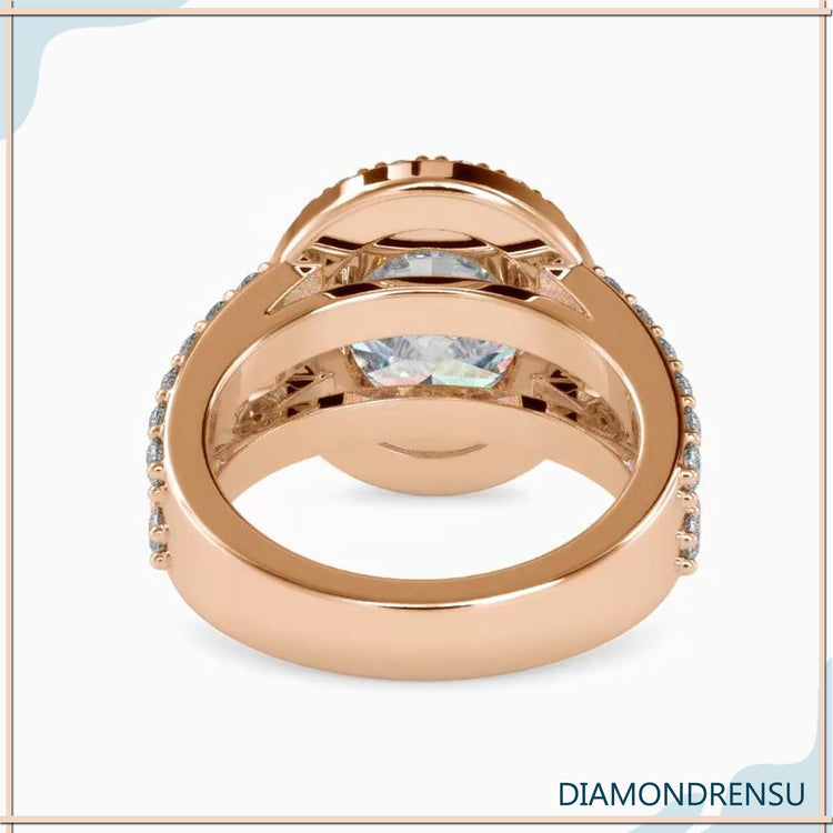 Oval wedding ring with lab grown diamond and halo setting.
