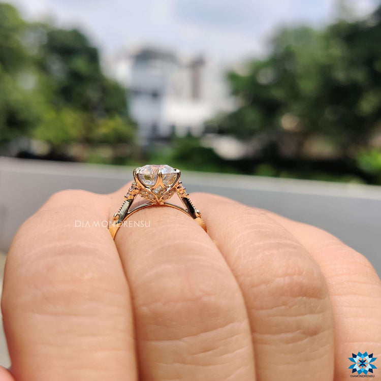 Vintage moissanite ring featuring four-prong setting.
