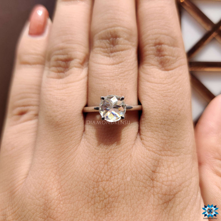 White gold moissanite solitaire with claw prong detail.
