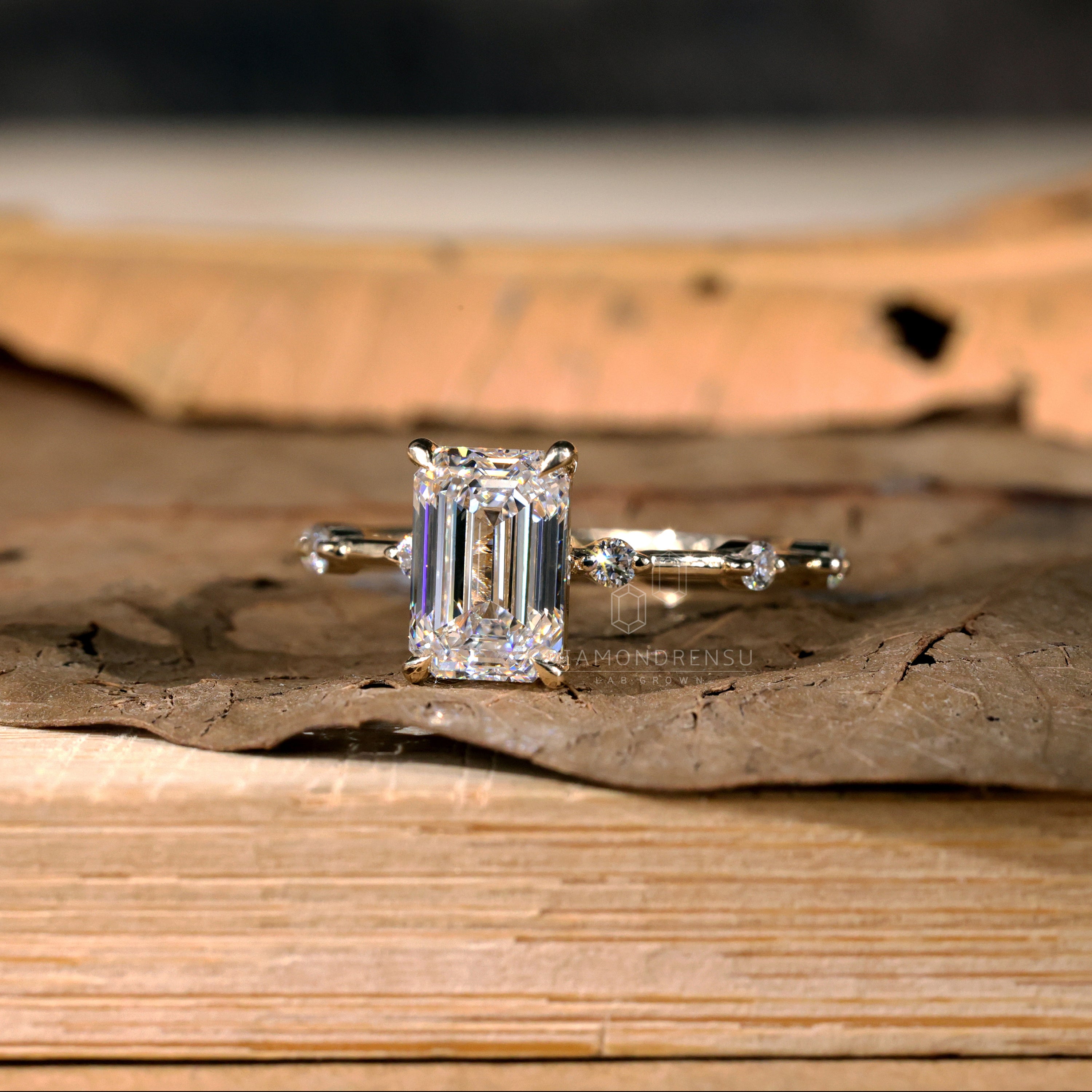 Exquisite emerald in ring with unique detailing.