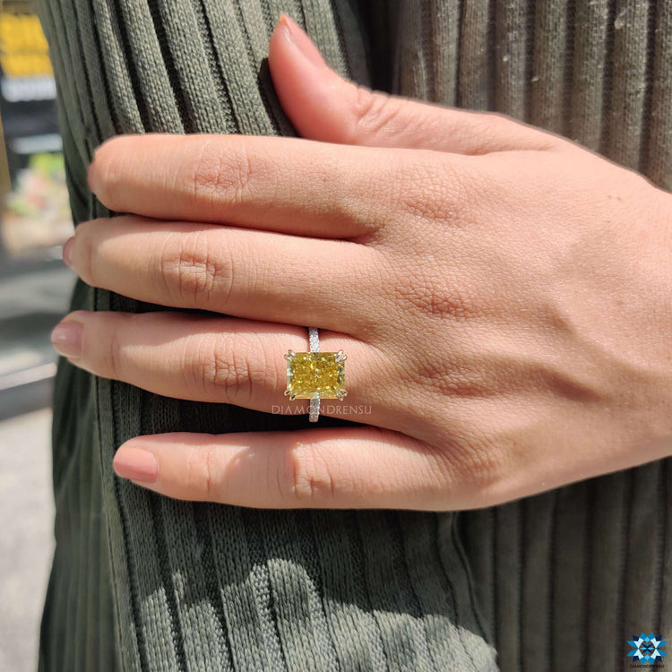 Double claw prong ring with radiant moissanite.
