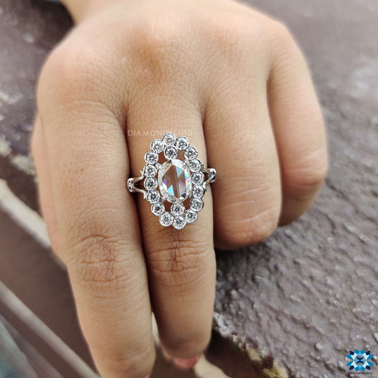 Halo moissanite ring with an oval rose cut centre stone.
