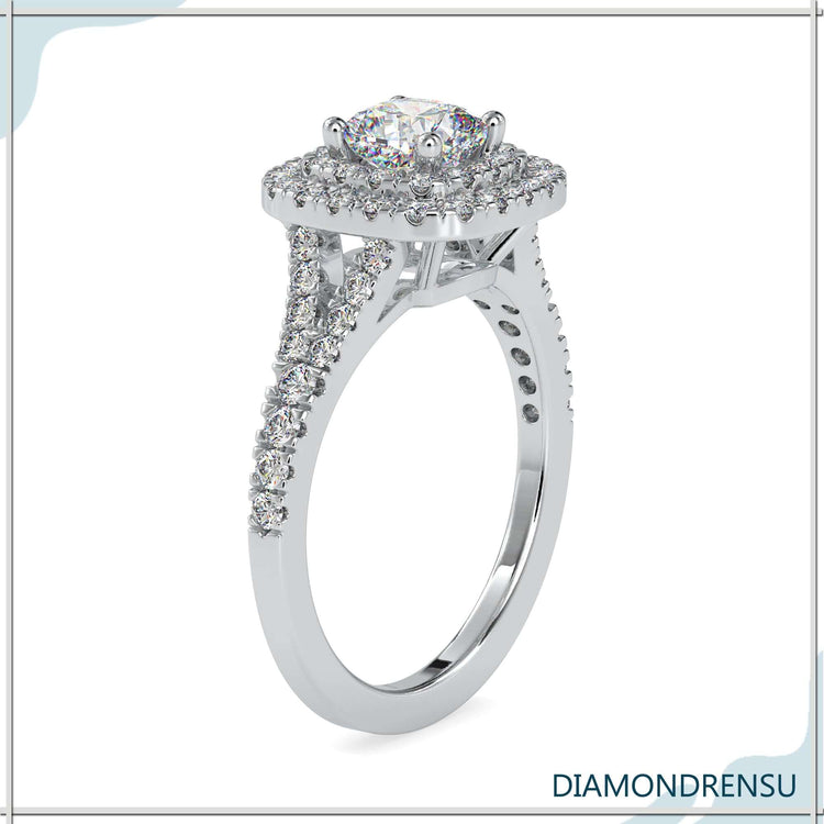 Rose gold engagement ring with split shank and lab diamond.
