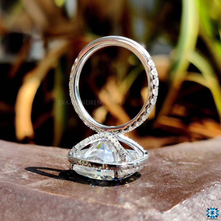 Cushion moissanite ring with hidden accent detail.
