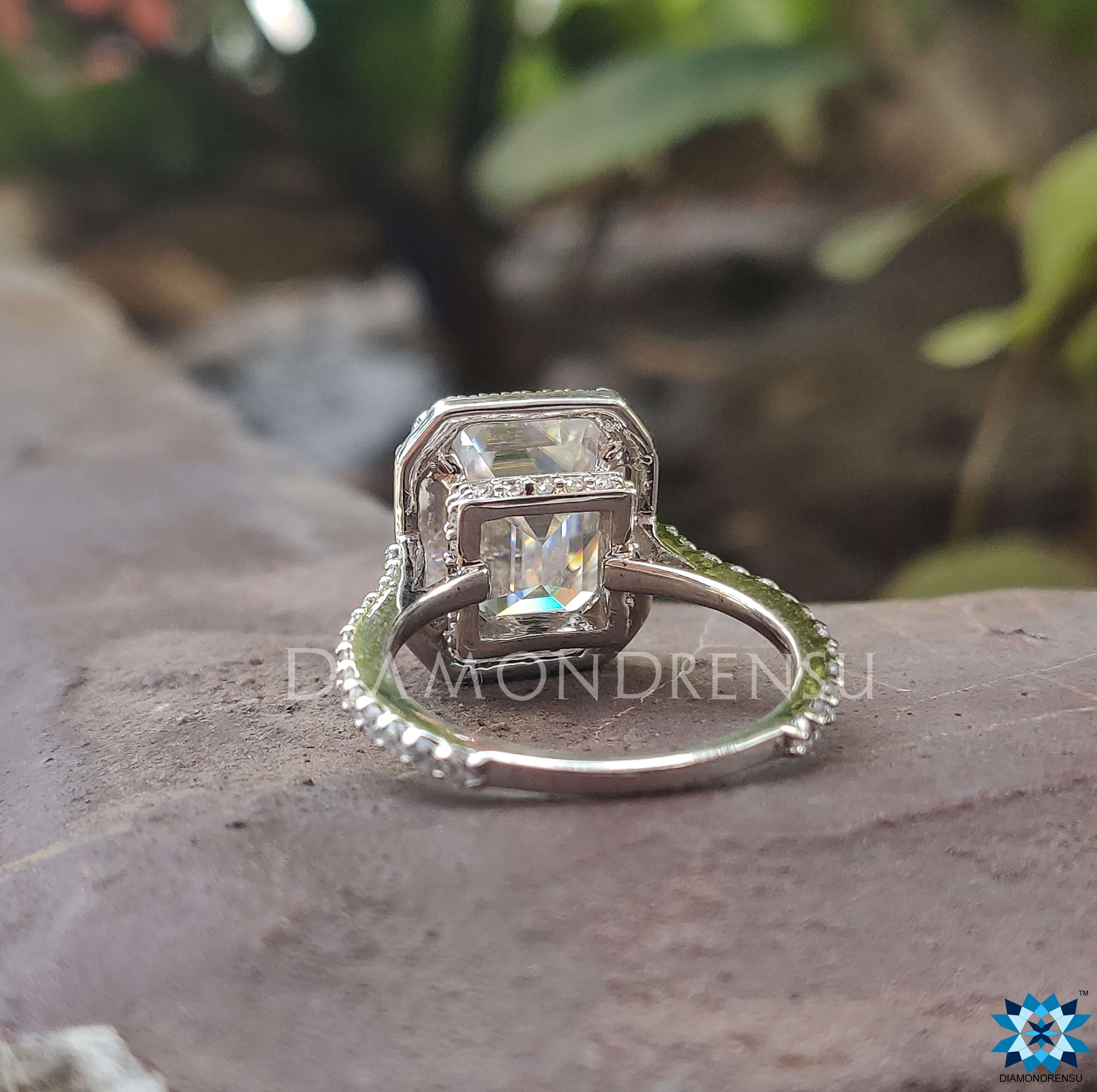 Moissanite halo ring featuring a beautiful emerald cut moissanite ring.